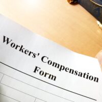 Workers compensation form on a table.